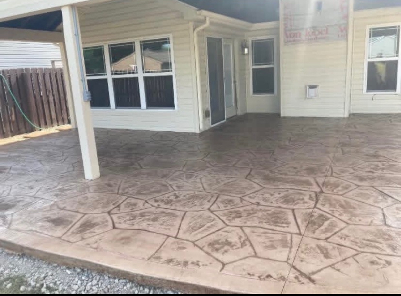 Decorative stamped concrete patio near a pool