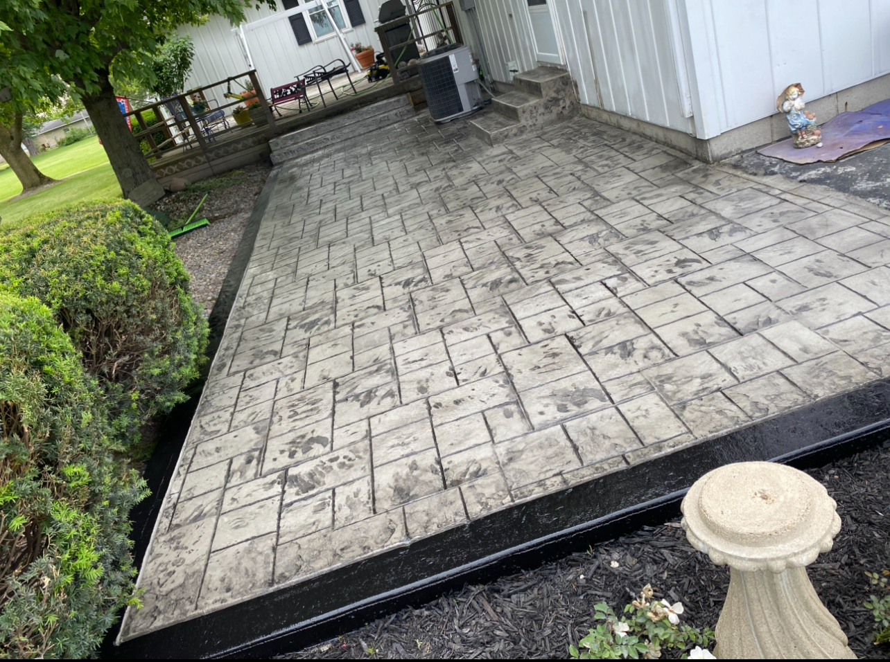 Stamped concrete patio with brick pattern